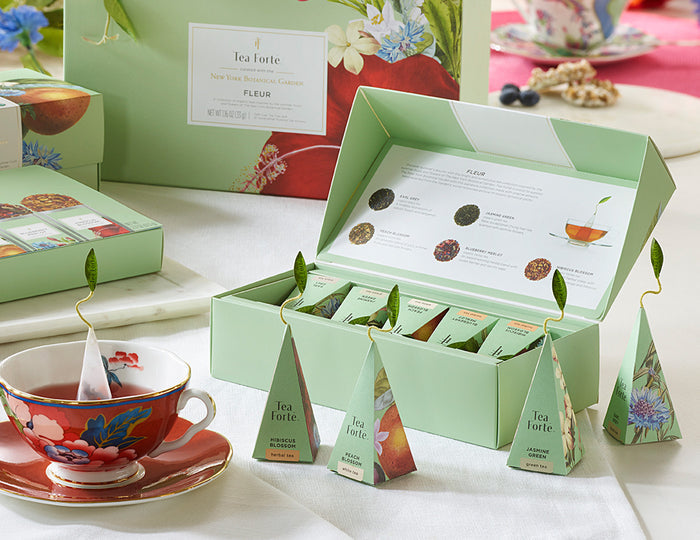 MAIN PDP | Fleur tea assortment in a 10 count petite presentation box on table