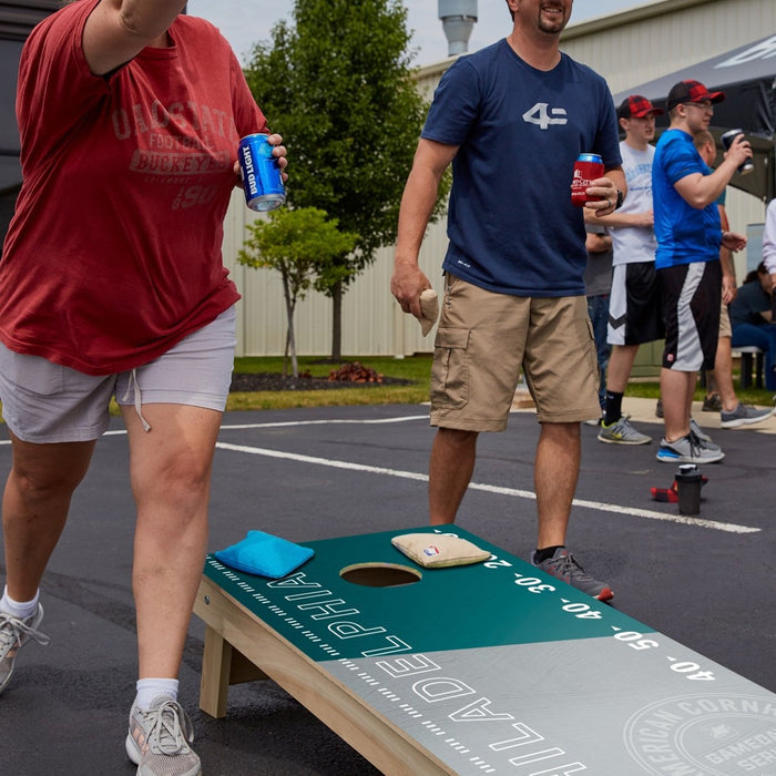 Premium wooden cornhole board with game day stadium graphics.