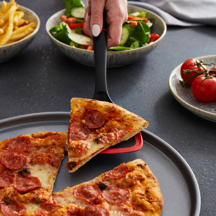 A slice of pizza being picked up
