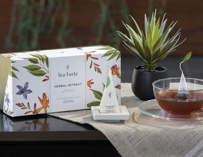 MAIN PDP | Herbal Retreat tea assortment in a 20 count presentation box on table