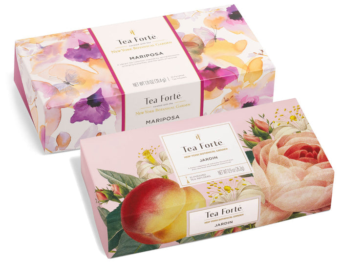 Two Tea Forte boxes with floral designs: Mariposa with purple flowers and Jardin with peach roses and botanical illustrations