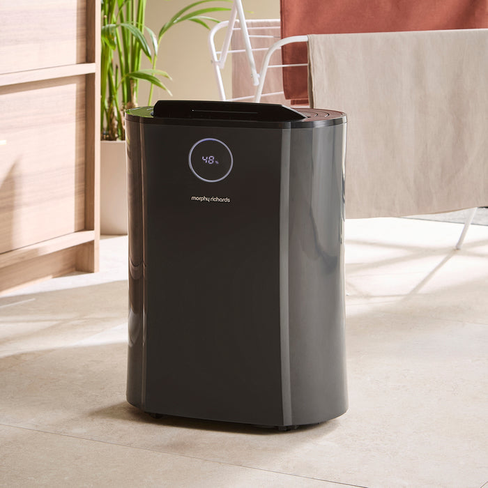 Person holding a Morphy Richards dehumidifier