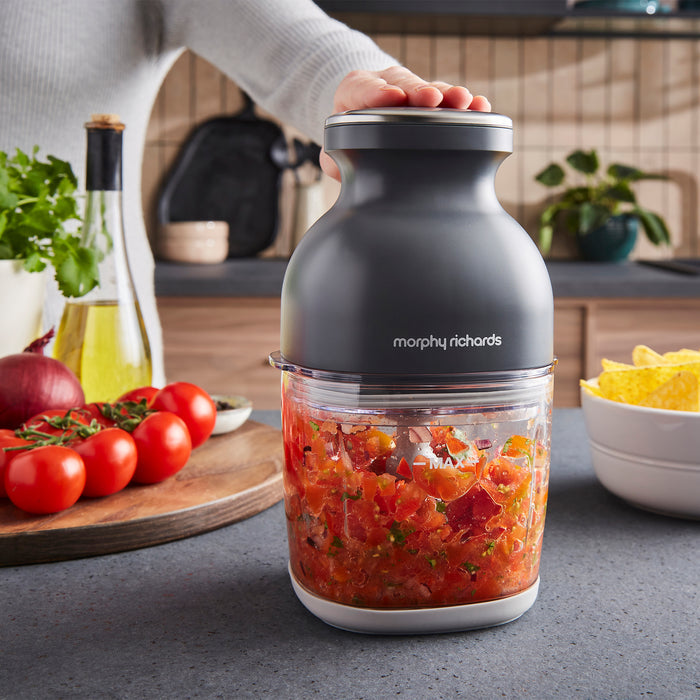 Morphy Richards mini chopper with chopped vegetables on a kitchen counter