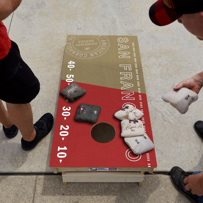 Premium wooden cornhole board with game day stadium graphics.