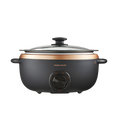 A rose gold and black slow cooker with a glass lid and analog control dial, featuring a hob-proof cooking pot.