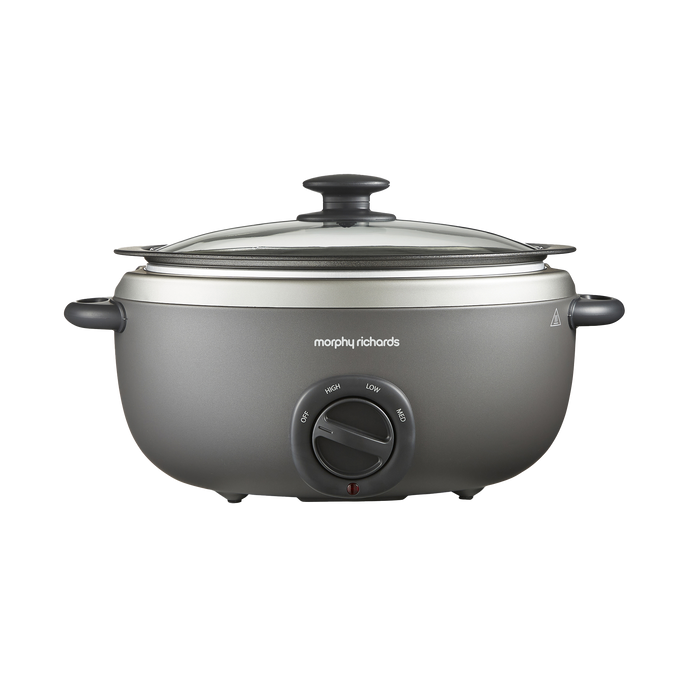 A gray Morphy Richards Sear & Stew Oval 6.5L Slow Cooker with a glass lid and a knob on the front.