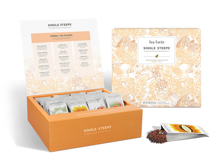 Herbal tea assortment in a 28 count chest of Single Steeps pouches with lid open