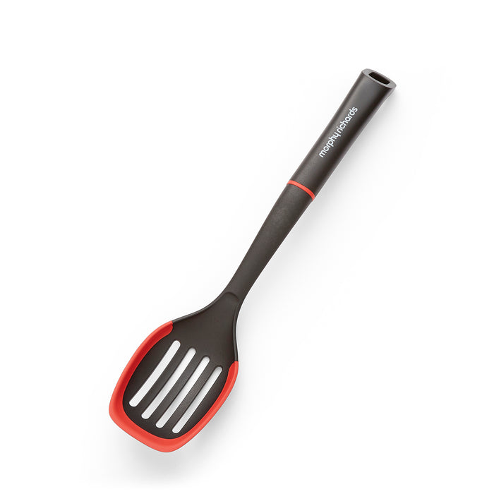 Black and red slotted spoon on a white background
