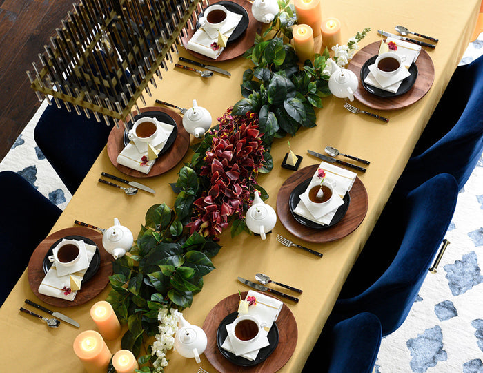 MAIN PDP | Solstice teaware on a large dining room table set for a dinner