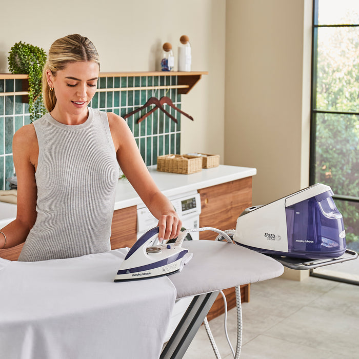 lady ironing in kitchen
