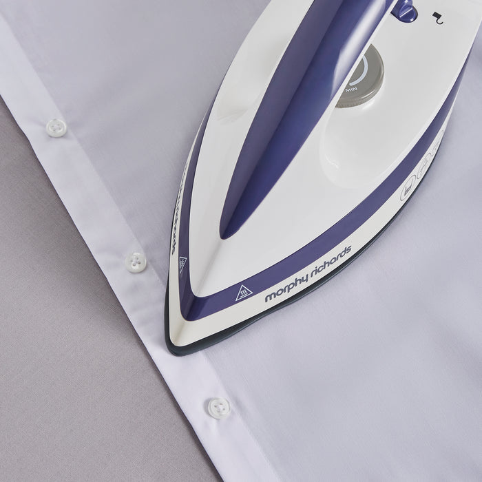 close up of iron and shirt