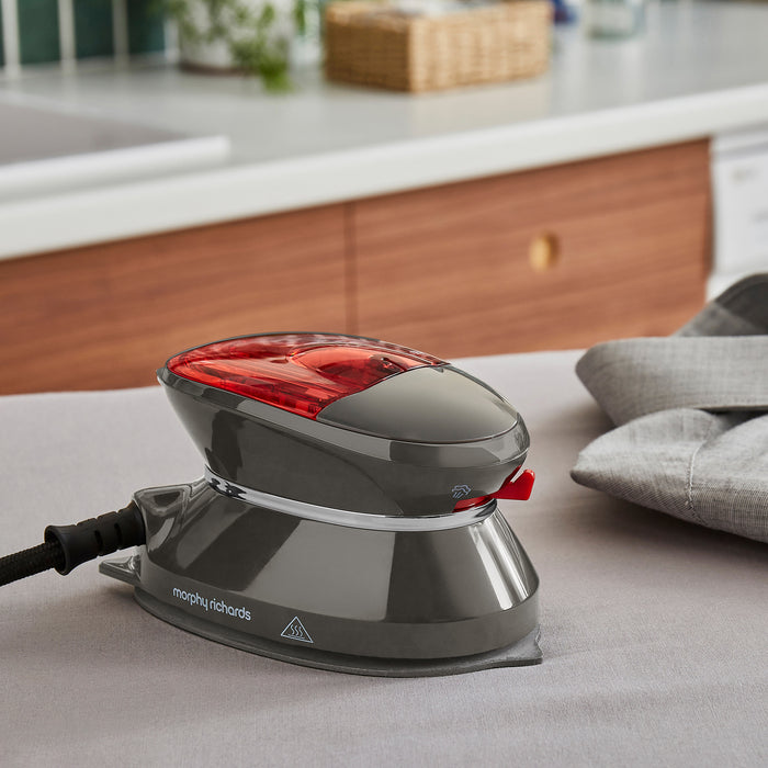 travel iron on ironing board