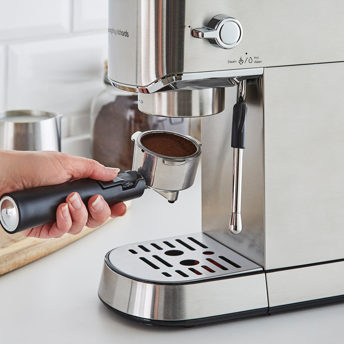 portafilter being attached to an espresso coffee machine
