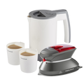 A travel iron and travel kettle set with a white kettle, grey iron, and two white cups filled with a liquid, all designed for travel use.