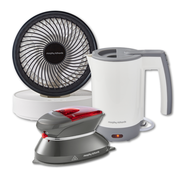 A set of travel essentials including a white portable USB fan, a travel kettle, and a travel iron, isolated on a white background.
