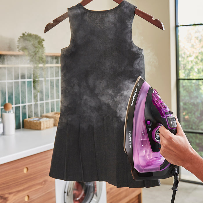 lady using morphy richards iron