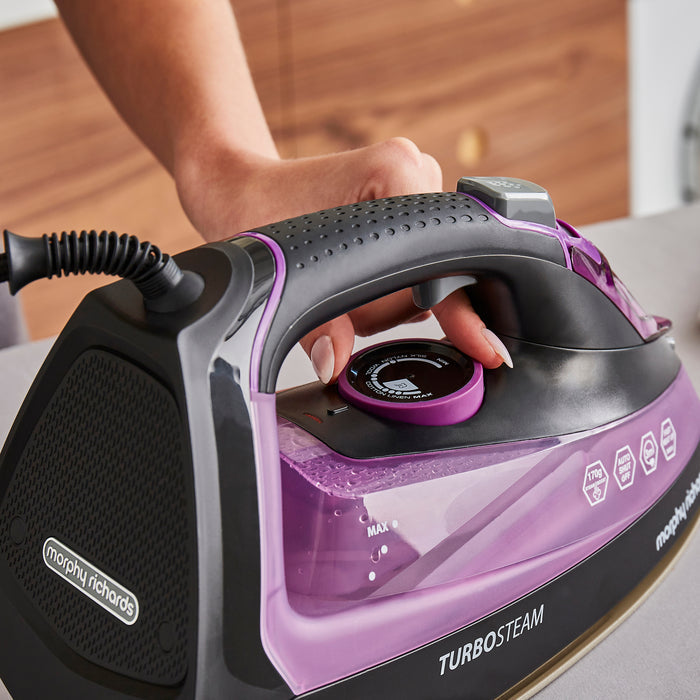 lady using morphy richards iron