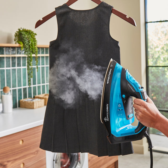 lady ironing with steam iron