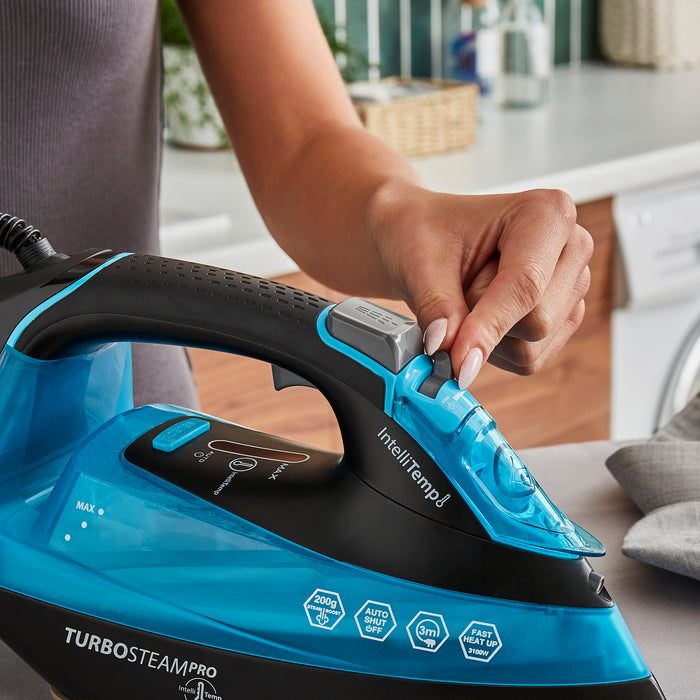lady ironing with steam iron