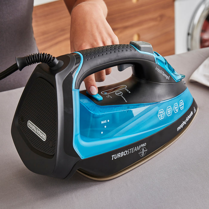 lady ironing with steam iron