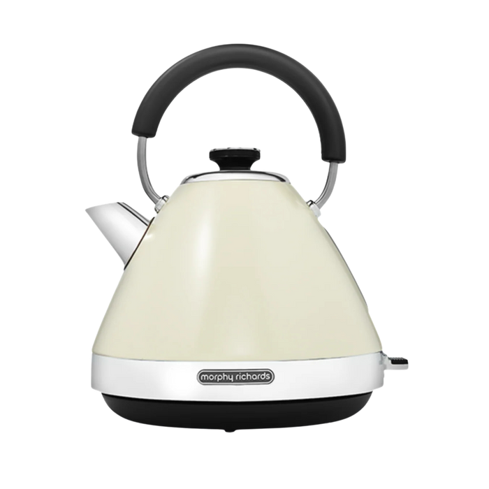 Cream pyramid kettle with black handle and base on a white background