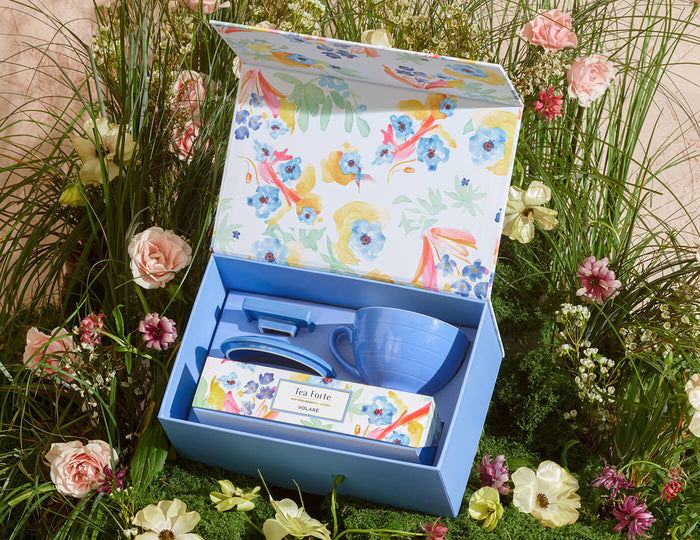 MAIN PDP | Volare Gift Set, shown open among grasses and wildflowers, revealing contents