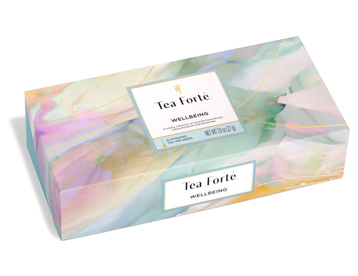 Tea Forte Wellbeing gift set box with pastel watercolor design and gold accents containing tea sachets.