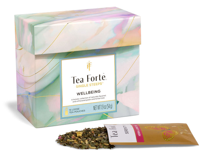 Tea Forte Wellbeing Single Steeps® Sampler box closed  with loose tea pouch in front